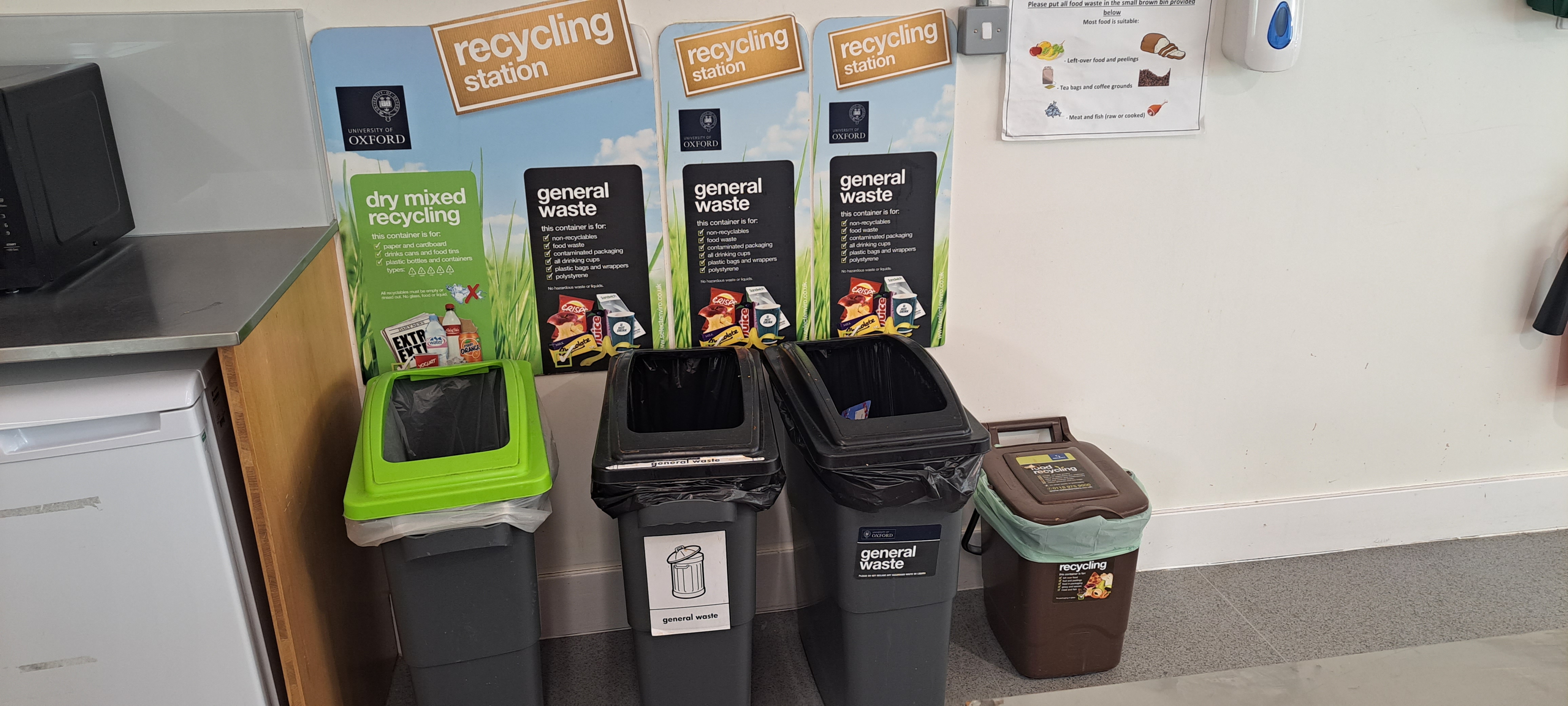 Recycling, waste and food waste bins in departmental kitchen