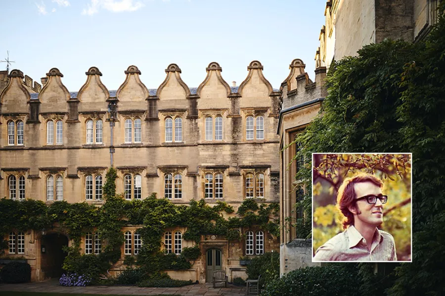 Peter Clifford against the backdrop of Jesus College
