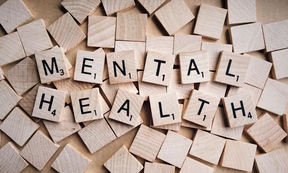 Scrabble tiles showing the words Mental Health
