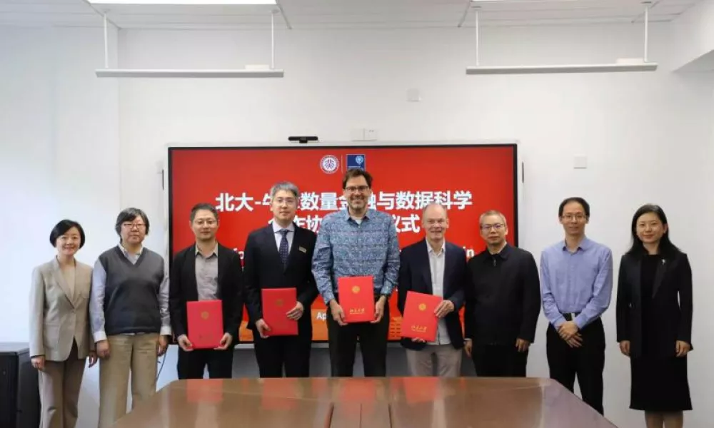 Researchers from both universities standing for a group photograph